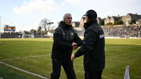 Two decorated figures getting ready for sideline battle